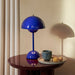 Cobalt Blue &Tradition VP9 Flowerpot Portable Table Lamp on end table.