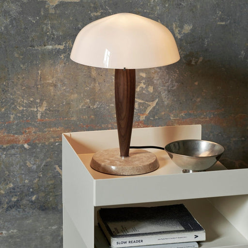 &Tradition SHY3 Herman Table Lamp on a side table with books