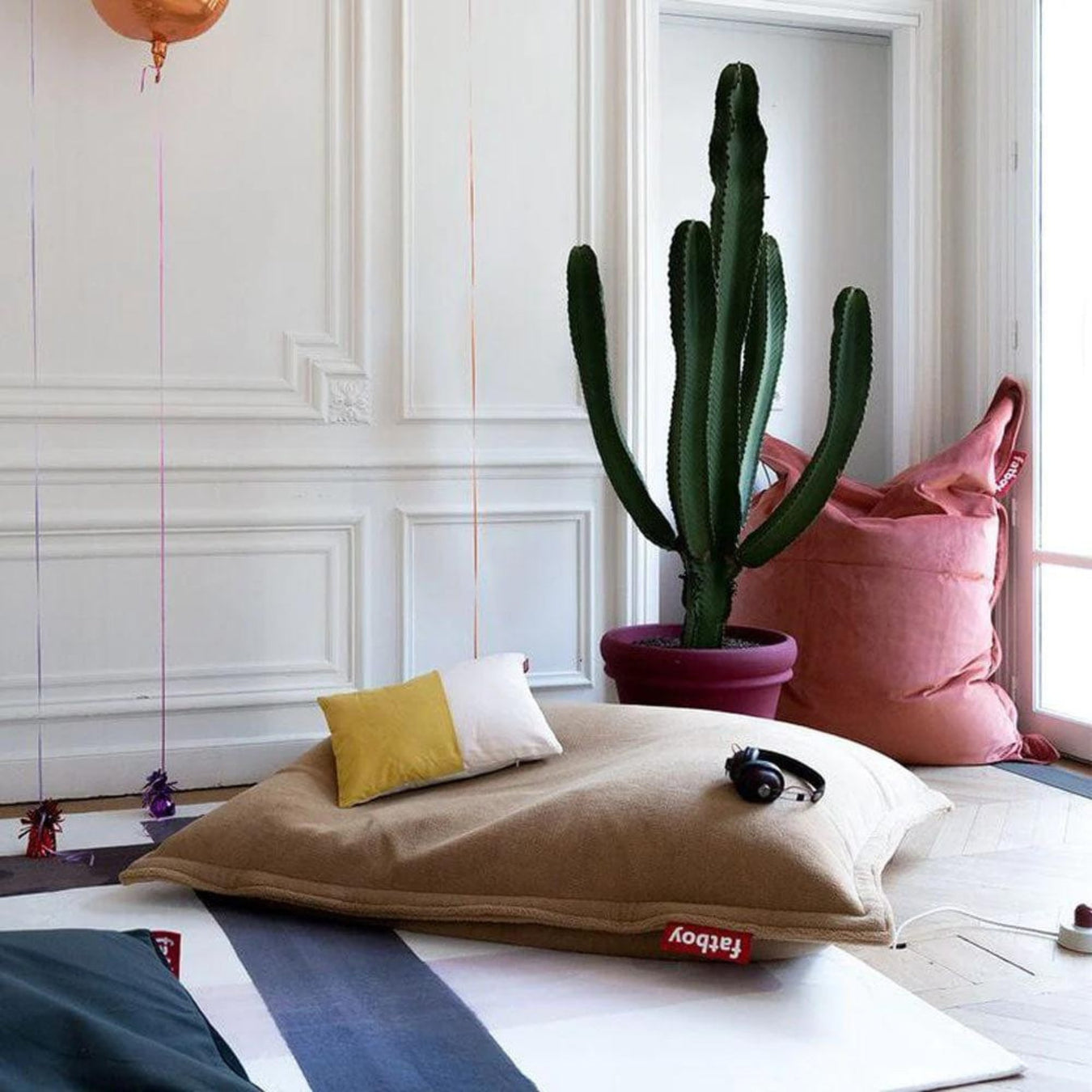 large light Brown Fatboy Beanbag with a cactus behind it. 