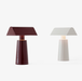 White Background with Two Lamps: One in Burgundy and One in Silk Grey - &Tradition MF1 Caret Portable Table Lamp