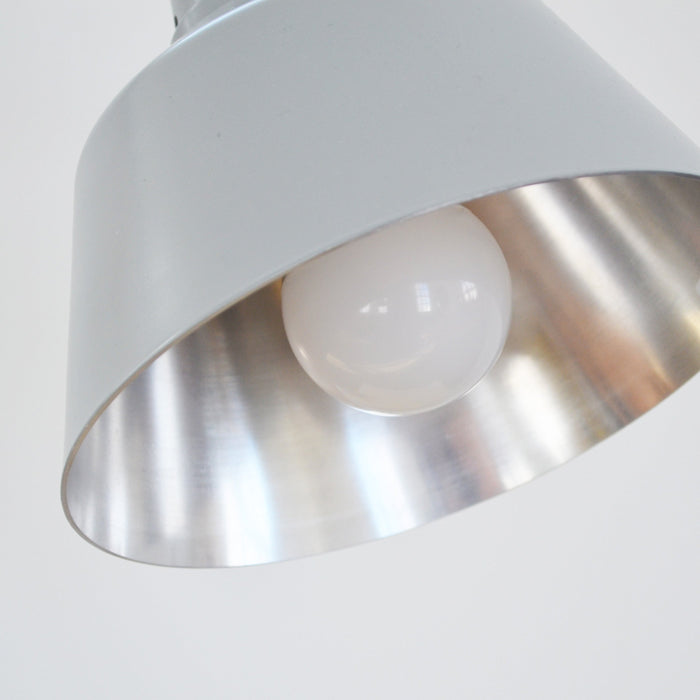 Close-up view of the bulb of the Midgard Modular Clamp Lamp 552, showcasing its design and brightness.